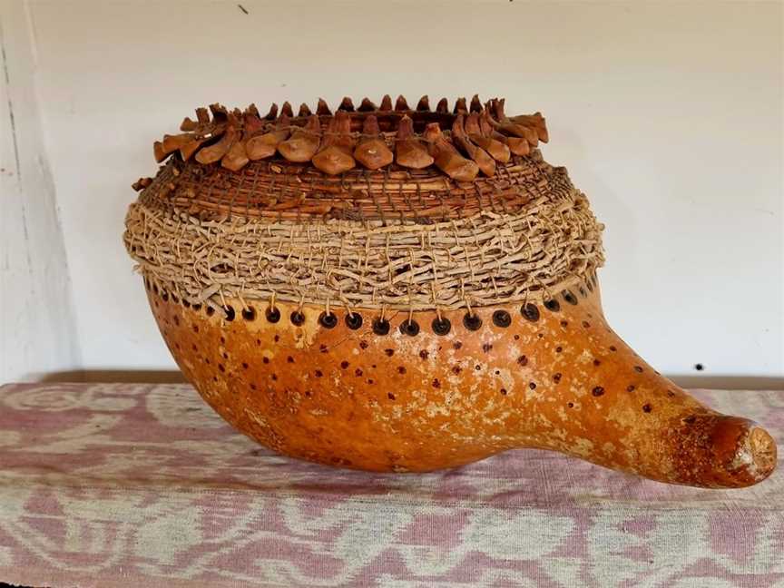 Giant gourd, coiled with palm influorescense, jacaranda flower stems and stone pine sheaths.
