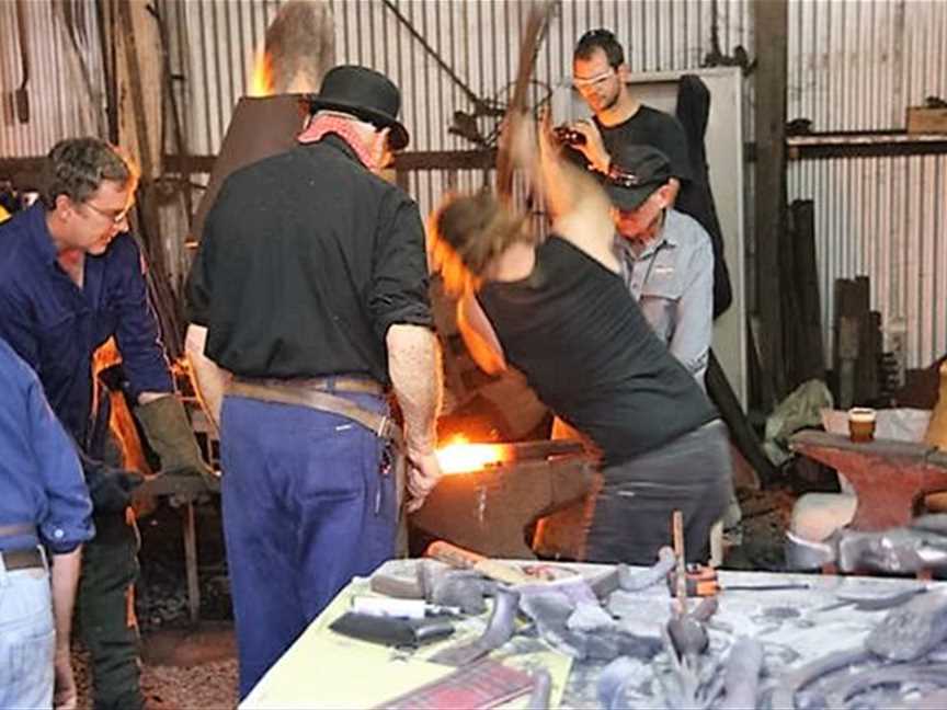 Blacksmiths at work in their forge