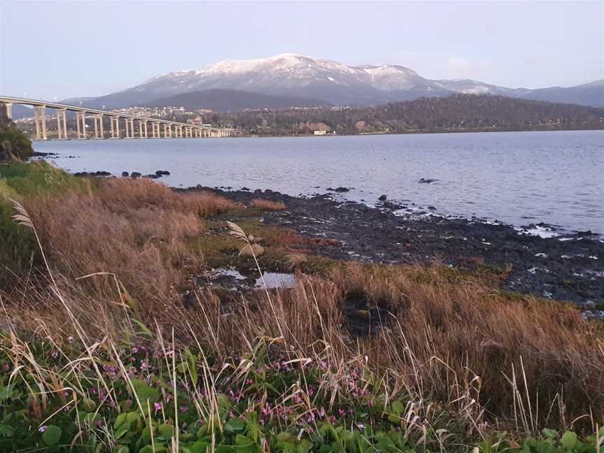 Winter views of a snow covered kunanyi / Mount Wellington, taken at the end of Yolla Street and the start of the Esplanade along the Rose Bay foreshore trail.