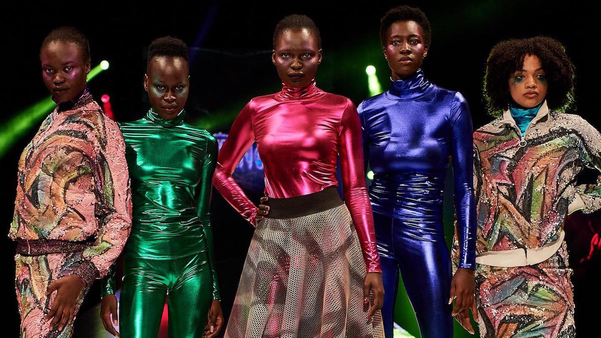 Five models wearing colourful, dramatic fashion outfits