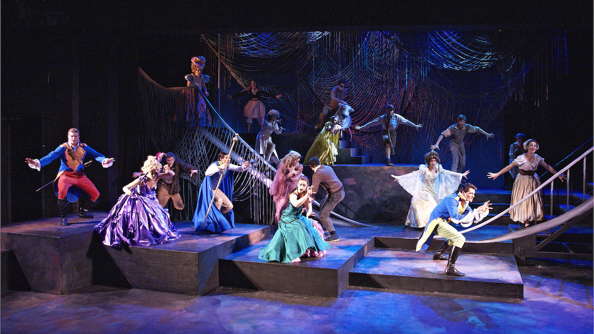 Students perform Into the Woods, a WAAPA production, with wild characters in bright blue satin costumes